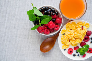 tasty breakfast with cereals and yoghurt raspberry