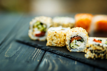 Japanese sushi on a rustic dark background