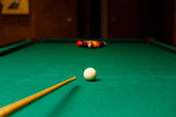 begin playing billiards, shot in white ball