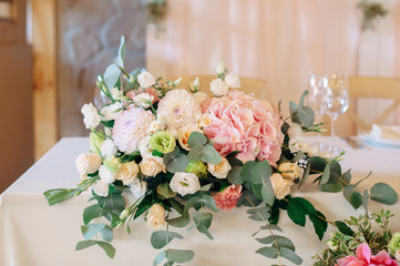 Candles with decor and flowers, peach, white and green color
