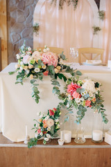Candles with decor and flowers, peach, white and green color