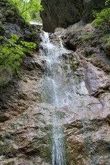 Fototapeta na wymiar Waterfall in Kysel ravine in Slovak Paradise National park, Slovakia