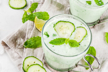 Summer food. Refreshing dishes. Cold soup of cucumber, avocado, with herbs and mint. With serving...