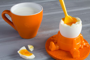 Boiled egg and milk for children's breakfast