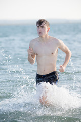 Teenage boy in the sea on a summer's day