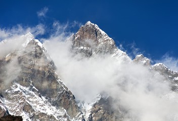 Fototapeta na wymiar Top of Lhotse with clouds on the top