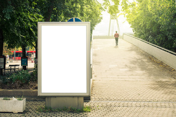 Blank mock up of vertical street poster billboard, daytime