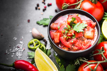 Traditional Latin American mexican salsa  sauce on black stone table