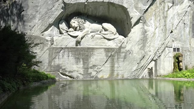 LUCERNE, SWITZERLAND : Dying Lion monument of Lucerne. It was carved on the cliff to honor the Swiss Guards of Louis XVI of France.