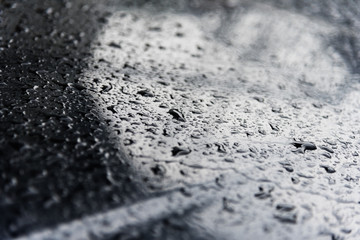 Drops of water at car hood, background
