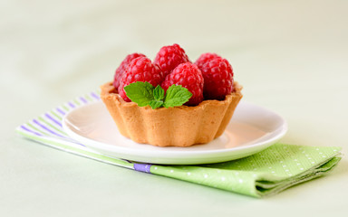 Mini tart with raspberries fruits