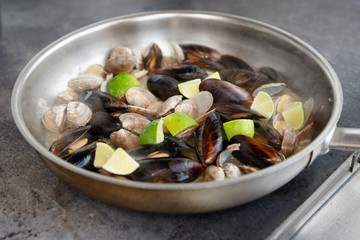 Clams and mussels on hot pan