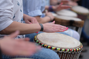 Speech by a group of girls playing ethnic drums at a concert of percussion music - 164320750