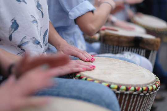 Speech by a group of girls playing ethnic drums at a concert of percussion music