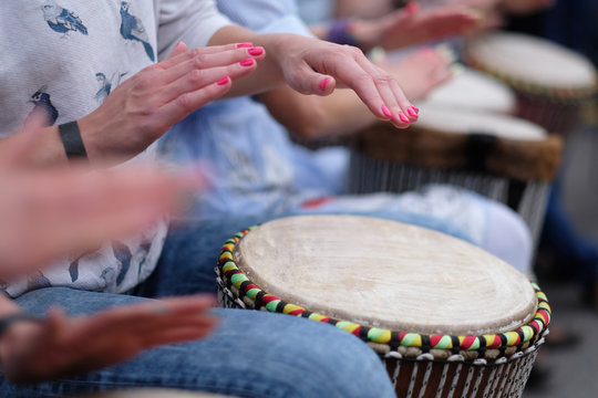 Speech by a group of girls playing ethnic drums at a concert of percussion music
