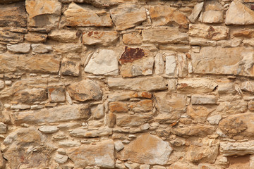 The detail, close up of the sandstone brick wall. The texture of the sandstone. It can be useld as the background.