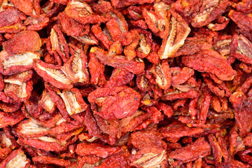 Sun-dried tomatoes flat lay, ingredients for Italian cuisine.