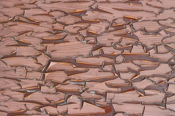Cracked from time withered old plastic 'like wood' sticker