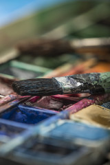 watercolors and paintbrush - art still life