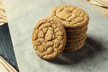 Biscuit sweet cookie background. Domestic stacked butter biscuit pattern concept,close up macro.Homemade cookies on wooden table.Cereal biscuits with the sesame,peanuts,sunflower and amaranth.
