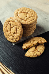 Biscuit sweet cookie background. Domestic stacked butter biscuit pattern concept,close up macro.Homemade cookies on wooden table.Cereal biscuits with the sesame,peanuts,sunflower and amaranth.