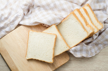 White bread on wood table for morning breakfast