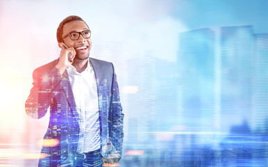 African American man on phone, blue city