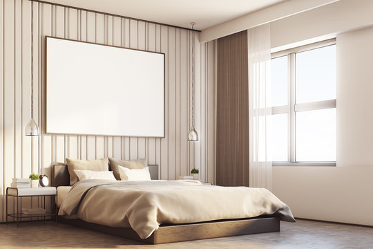 Beige bedroom with a large poster, side