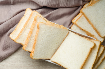 White bread on wood table for morning breakfast