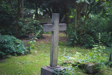 gravestone on / cemetery - stone cross on grave
