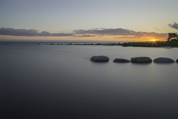 Sunset over Ocean with Breakwater