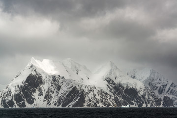 Icebergs, glaciers and mountains along the Antarctic Peninsula.