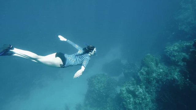 Woman enjoying a snorkel adventure  while on vacation