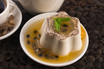 Panna cotta dessert with passion fruit and mint