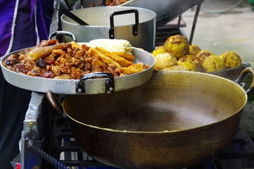 Close up of hornado roasted pork with a corn, ecuadorian traditional typical andean food over a tray