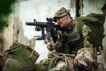 Army soldier during the military operation in the city. war, army, technology and people concept.