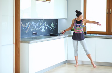Fototapeta premium Fit and attractive young woman preparing healthy meal. Woman.