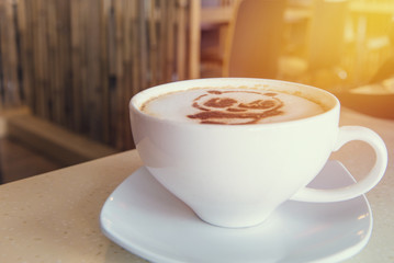 latte art coffee or cappuccino on wooden table background