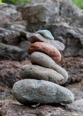 Stacked rocks along a rocky shoreline