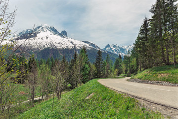  road against the background of mountains in the Alps