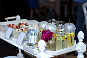 Lemonade and sandwiches at a party. A table with snacks.