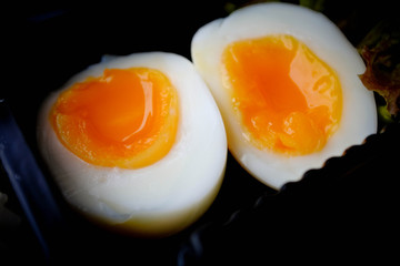 Close up medium rare boiled egg, Natural food color, cooked white egg but fuse egg yolk. perfect