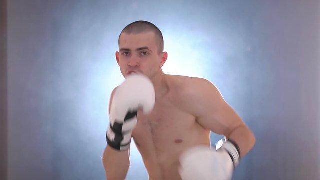Young boxer warming up before a fight. Slow motion