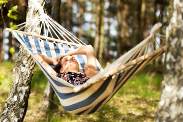 Woman relaxing in the hammock