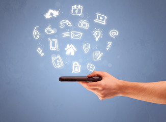 Hand holding tablet phone with drawn icons