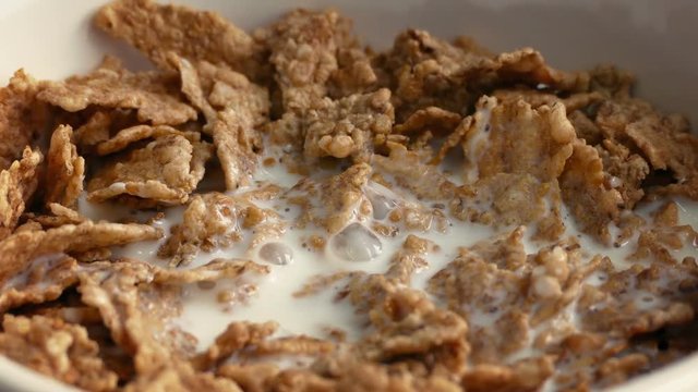 Milk Pours On Cereal Closeup