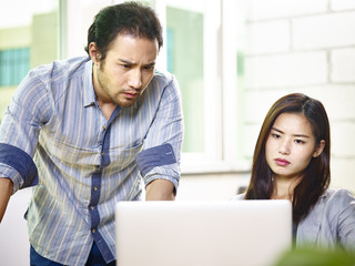 frustrated asian business people