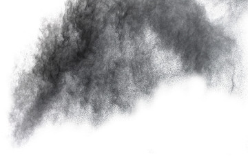 Black powder explosion. Closeup of black dust particles explode isolated on white background.