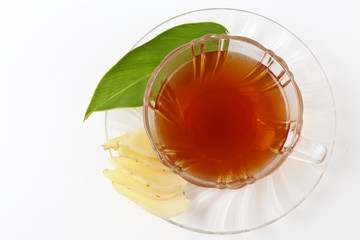 Top view of fresh ginger root and tea isolated on white