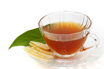slice of fresh ginger root and tea isolated on white